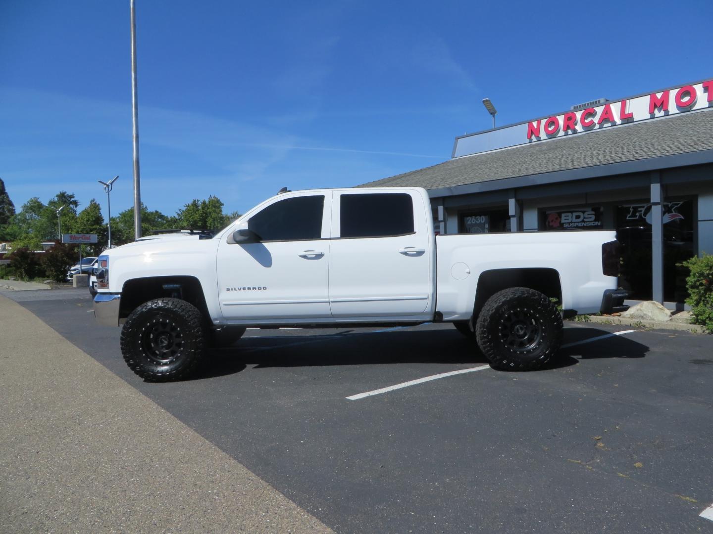 2018 White /BLACK Chevrolet Silverado 1500 LT (3GCPCREC7JG) with an 5.3L V8 OHV 16V engine, automatic transmission, located at 2630 Grass Valley Highway, Auburn, CA, 95603, (530) 508-5100, 38.937893, -121.095482 - Must see Pre Runner.... CST front lift spindals, Camburg UCA's, King Adjustable 2.5 Coil-overs, King 2.5 rear shocks, 35" Toyo RT Trail tires, 17" Method Race wheels, MZ front skid plate, G2 rear differntail cover, Full size bed mounted spare tire, Black Vinyl roof wrap, smoke tail lights and 3rd br - Photo#7